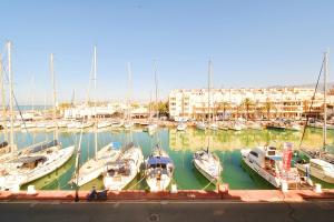 a group of boats docked in a marina at EXPOHOLIDAYS - Galeon PUERTO DEPORTIVO in Almerimar