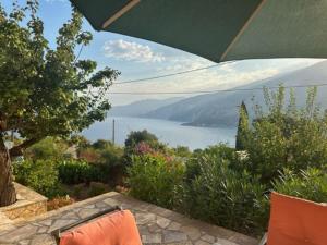 a patio with a view of a lake at Villa Zola with Views in Zóla
