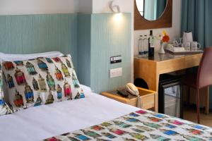 Postel nebo postele na pokoji v ubytování MUR Neptuno Gran Canaria - Adults Only