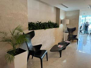 Area soggiorno di Alliance Palace By Marriott