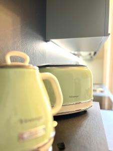 a toaster sitting on a counter in a kitchen at ComeCasa Turin Nest 2 Bedroom Comfort in Turin