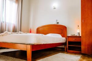 Hotel Agosto Neto客房内的一张或多张床位