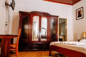 Hotel Agosto Neto客房内的一张或多张床位