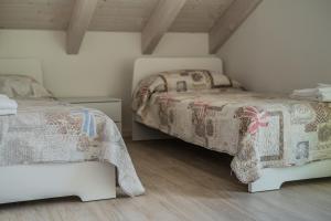Posteľ alebo postele v izbe v ubytovaní Le Dune Verdi