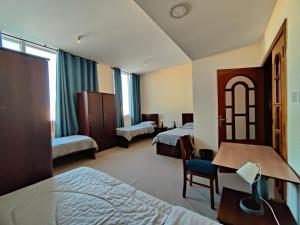 Postel nebo postele na pokoji v ubytování Oasis Hostel