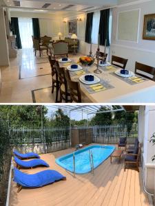 a dining room with a table and a swimming pool at A&B Ialysos villas and apartments in Ialysos