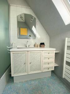 a bathroom with a sink and a mirror at Black Rock Champagne in Moussy +22 photos