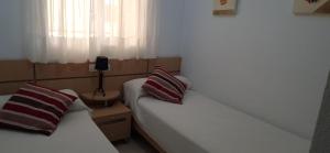 Postel nebo postele na pokoji v ubytování Costa Azahar II Nº1055