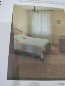 a picture of a bedroom with a large bed at apartamento torrealtina in Luarca