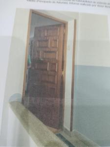 a view of a room with a door and a mirror at apartamento torrealtina in Luarca