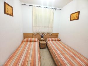 Ein Bett oder Betten in einem Zimmer der Unterkunft Costa Azahar II Nº 1041