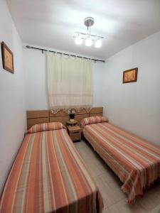 Ein Bett oder Betten in einem Zimmer der Unterkunft Costa Azahar II Nº 1041