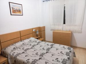 Ein Bett oder Betten in einem Zimmer der Unterkunft Costa Azahar II Nº 1041
