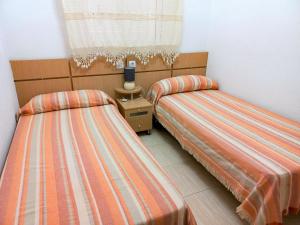 Ein Bett oder Betten in einem Zimmer der Unterkunft Costa Azahar II Nº 1041