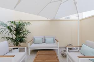 Posezení v ubytování New Elegance Suites Guesthouse