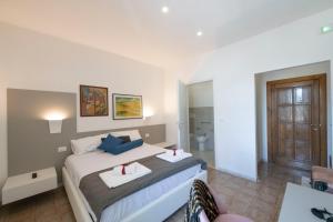 Postel nebo postele na pokoji v ubytování B&B D'Amely