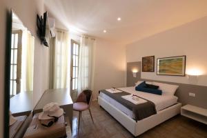 Postel nebo postele na pokoji v ubytování B&B D'Amely