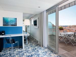 a hotel room with a view of a balcony at Ibis Styles Menton Centre in Menton