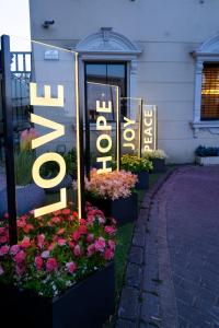 a sign for a flower shop in front of a building at Grand Sapphire Hotel & Banqueting in Croydon