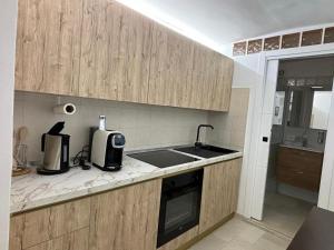 Kuchyň nebo kuchyňský kout v ubytování Mecy's Home