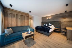Postel nebo postele na pokoji v ubytování Hotel Stubai