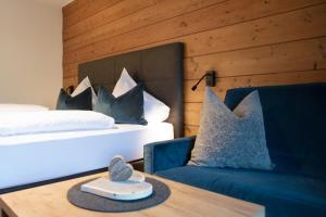 Postel nebo postele na pokoji v ubytování Hotel Stubai