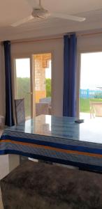 a glass table in a living room with a view at first row villa in Marsa Matruh