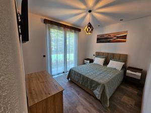 Postel nebo postele na pokoji v ubytování Casa Requinte - Jacuzzi