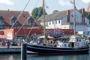a group of people on a boat in the water at Baltic Kölln Hotel in Heiligenhafen