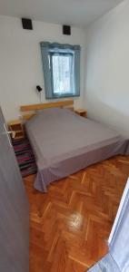 Katil atau katil-katil dalam bilik di Apartman Joanna