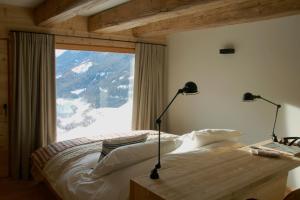 Een bed of bedden in een kamer bij Montagne Alternative