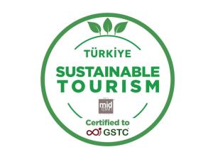 a green logo with the words turmeric sustainable tourism at Midtown Hotel in Istanbul