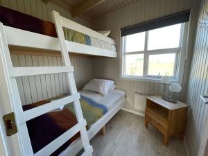 Postel nebo postele na pokoji v ubytování Eldhraun Holiday Home