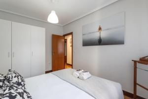 Łóżko lub łóżka w pokoju w obiekcie Etxebarria apartment by People Rentals