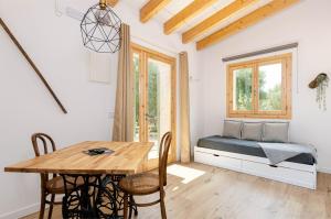 a room with a bed and a table and chairs at Agroturismo Cal Tio 4, YourHouse in Costitx