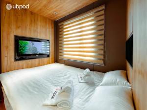 Postel nebo postele na pokoji v ubytování UBPOD- The First Capsule Hotel in Mongolia