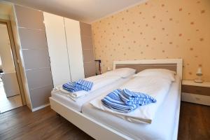 Ein Bett oder Betten in einem Zimmer der Unterkunft Haus Königsdüne II/8