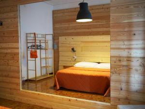 A bed or beds in a room at B&B Porto Del Bivio