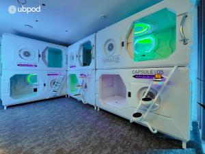a room with a row of washers and dryers at UBPOD- The First Capsule Hotel in Mongolia in Ulaanbaatar