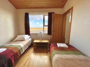 Postel nebo postele na pokoji v ubytování Eldhraun Holiday Home + 37 fotografií