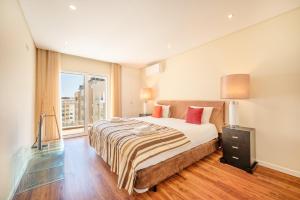 Postel nebo postele na pokoji v ubytování GuestReady - Parede Residence near the beaches