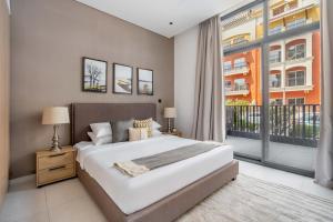 מיטה או מיטות בחדר ב-GuestReady - Vida de luxo na Beverly Residence