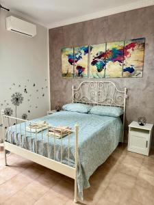 Tempat tidur dalam kamar di Casa Affitto Breve Frattamaggiore