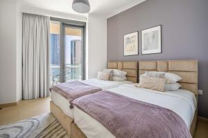 Postel nebo postele na pokoji v ubytování GuestReady - Glowing Retreat near Burj Khalifa