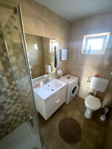 Fotografie z fotogalerie ubytování APARTMANI GOGA s grijanim bazenom v destinaci Dobropoljana