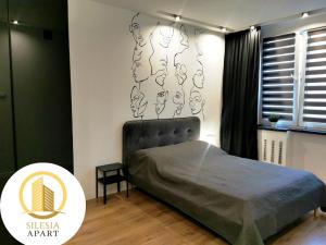 Postel nebo postele na pokoji v ubytování Apartament Ceglany