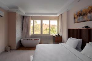 Postel nebo postele na pokoji v ubytování Dream Inn Pyramids View