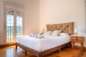 A bed or beds in a room at Fidalsa Majestic