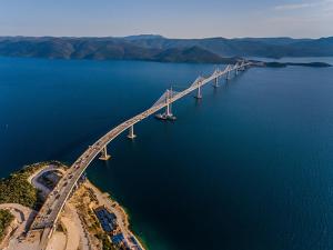 an aerial view of a bridge over a body of water at Studio apartments RAFAEL - 4 minutes to the beach in Gradac