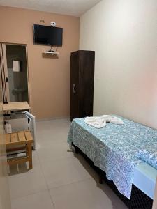 Μια τηλεόραση ή/και κέντρο ψυχαγωγίας στο Hotel Pousada Bela Manhã +57 φωτογραφίες